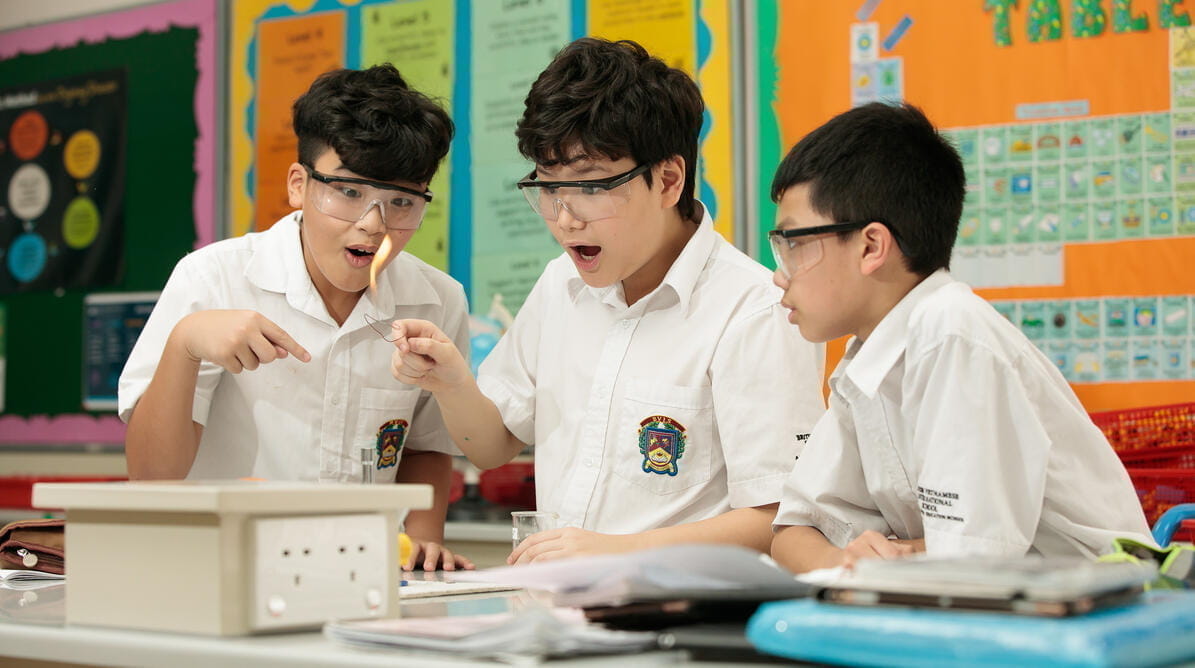 Students performing an experiment